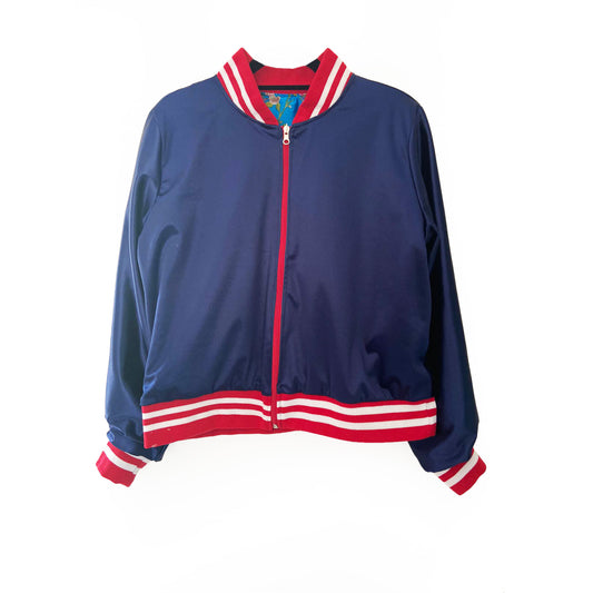 Blue jacket with red and white accents on a white background