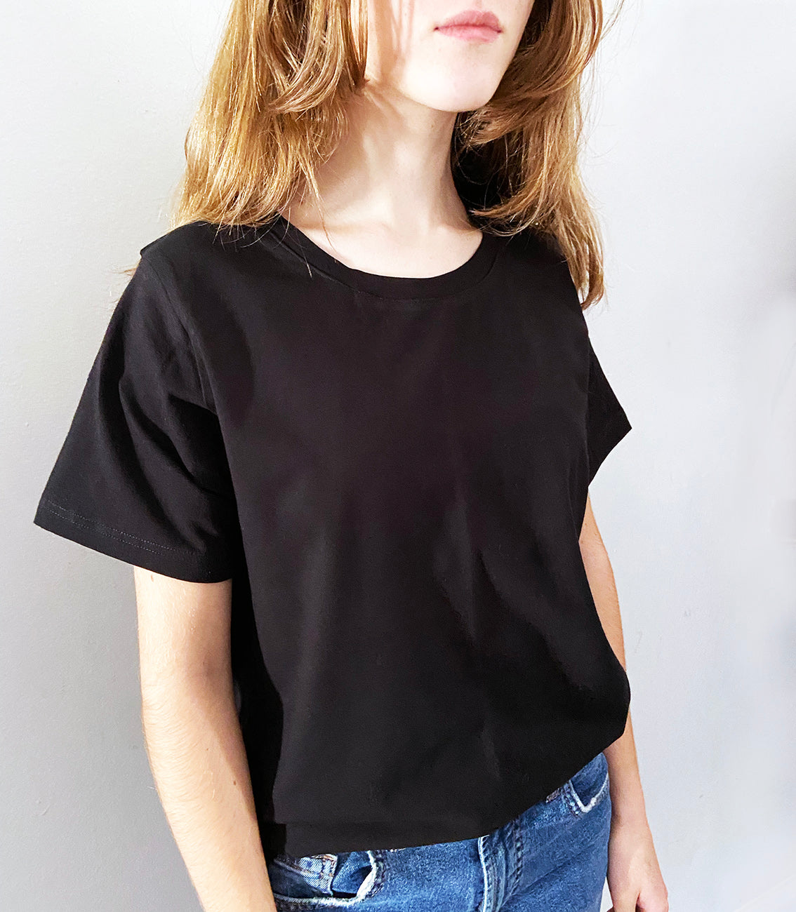 Close up of young girl wearing a black t-shirt
