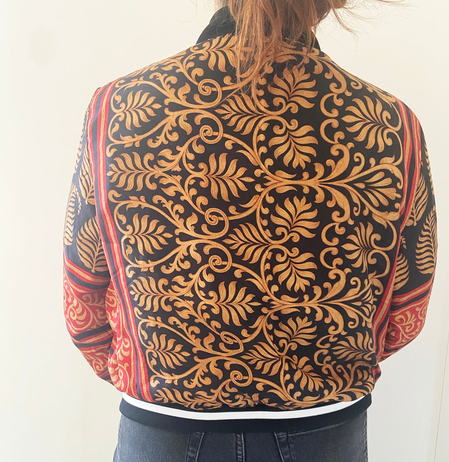 Person wearing a jacket with a detailed pattern on the back