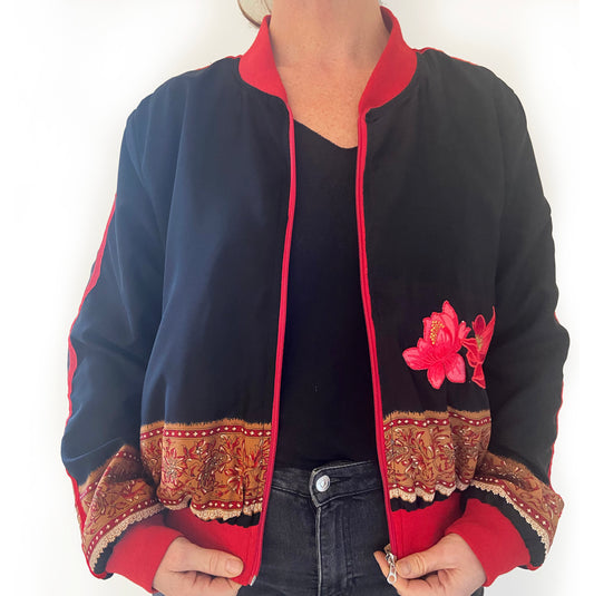 Black jacket with red and gold embroidery on a white background