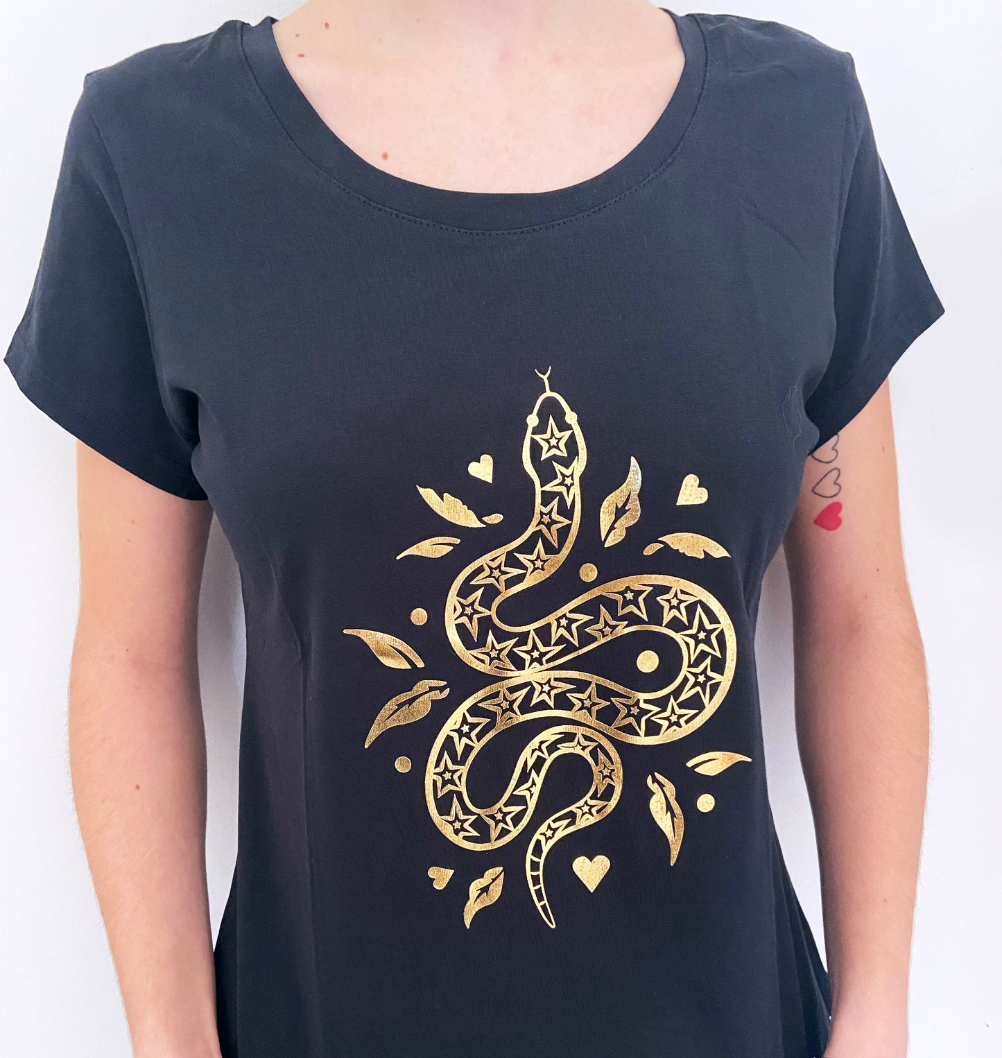 Black t-shirt with a gold snake design on a white background