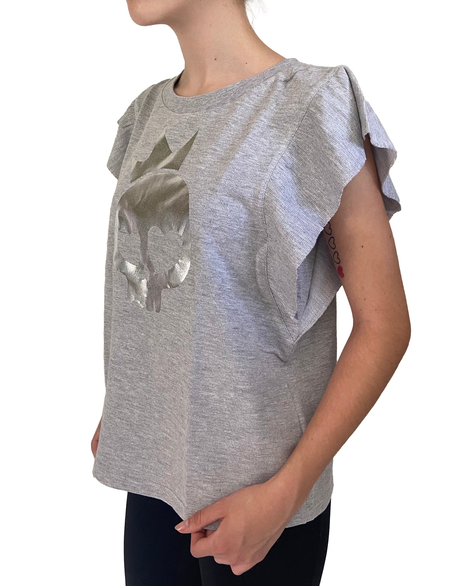 Gray ruffled sleeve top worn by a person on a white background