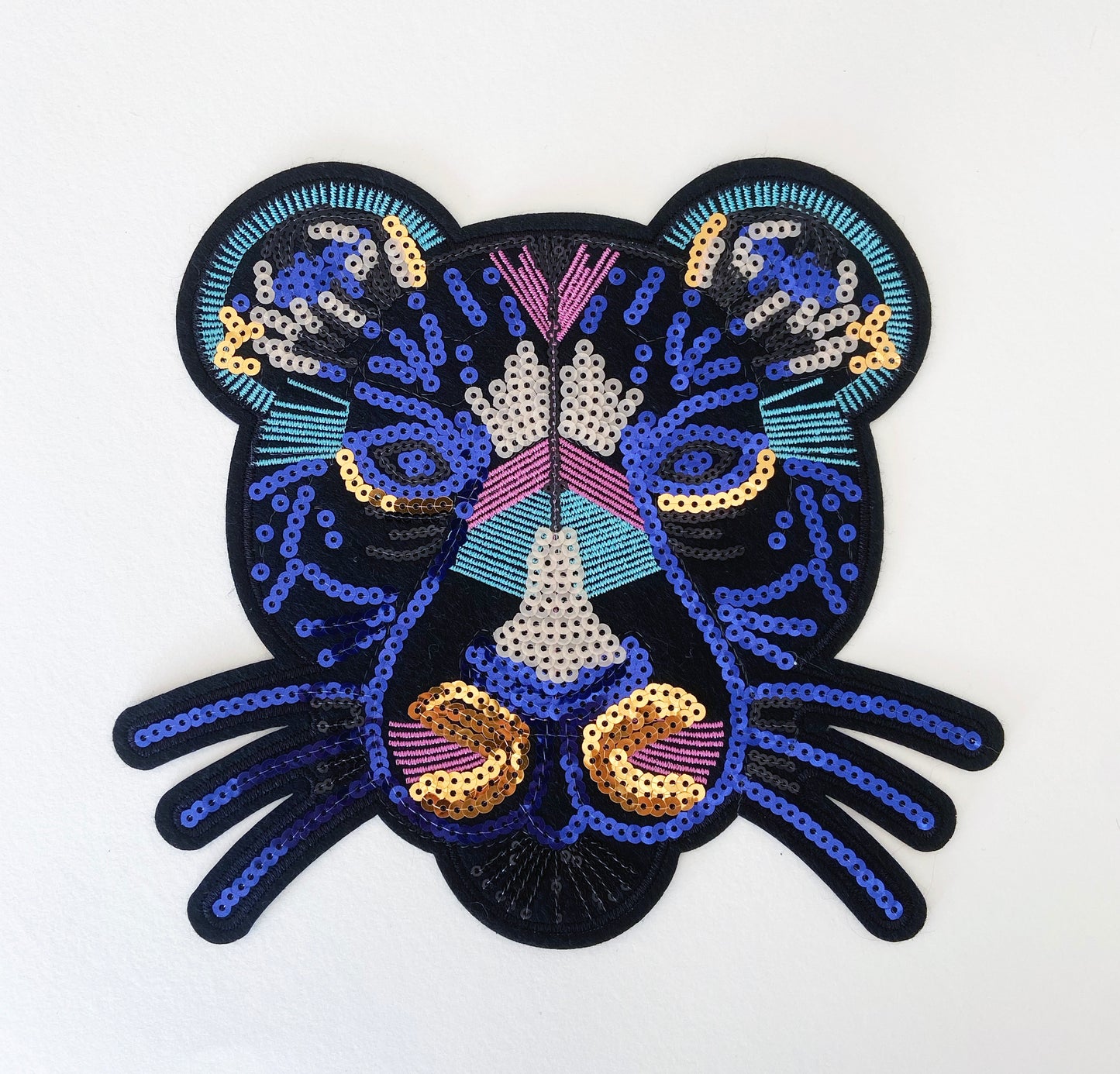 Decorative patch with a colorful design on a white background