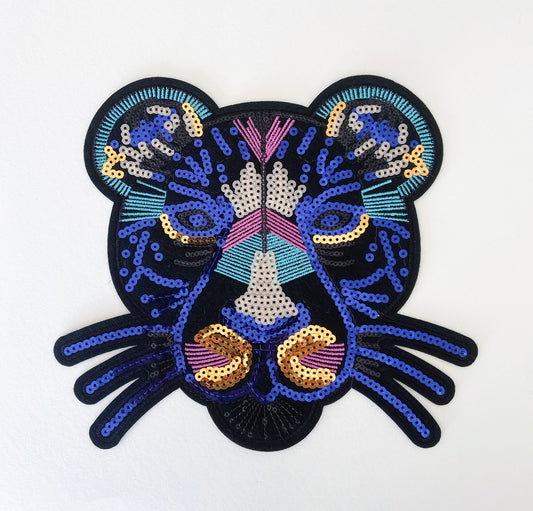 Decorative patch with a colorful design on a white background