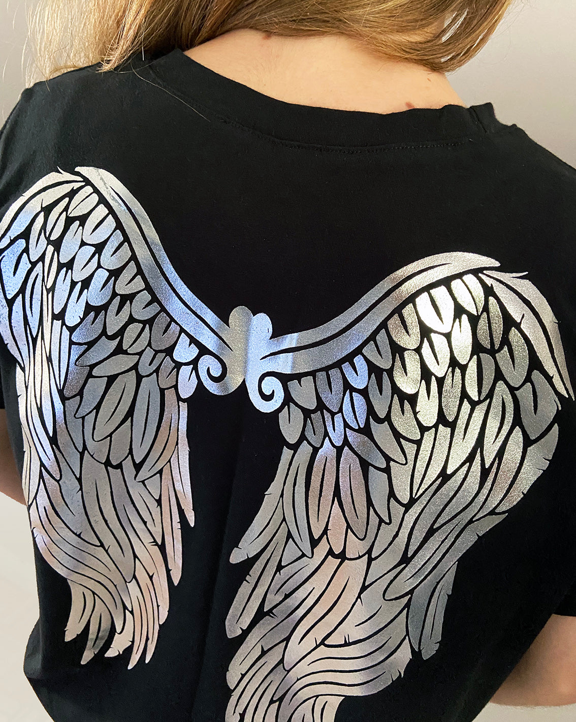 Close up of silver foil wings print