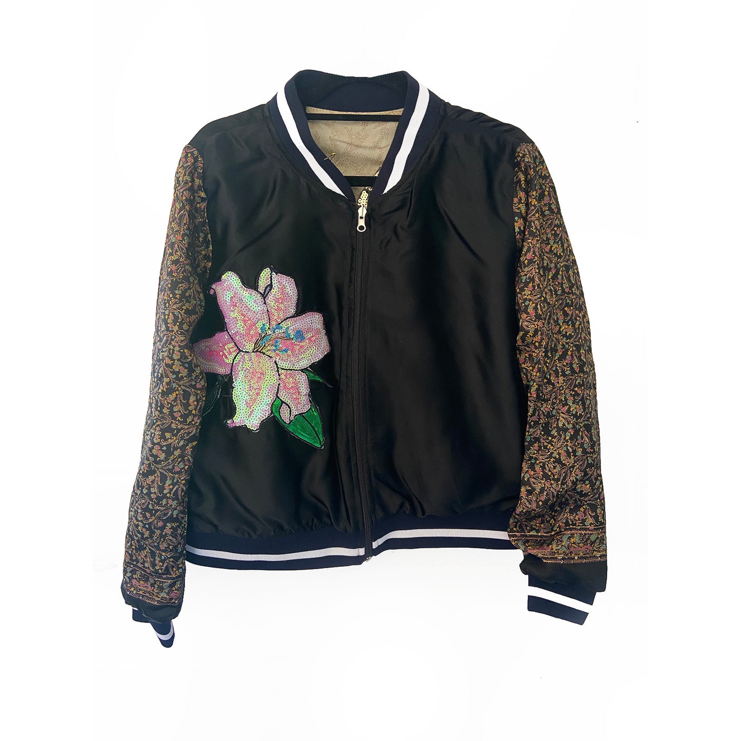 Black jacket with floral sequin design on a white background