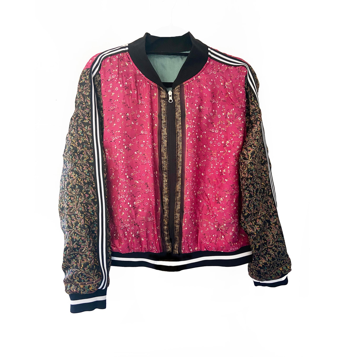 Pink and black floral jacket with patterned sleeves on a white background