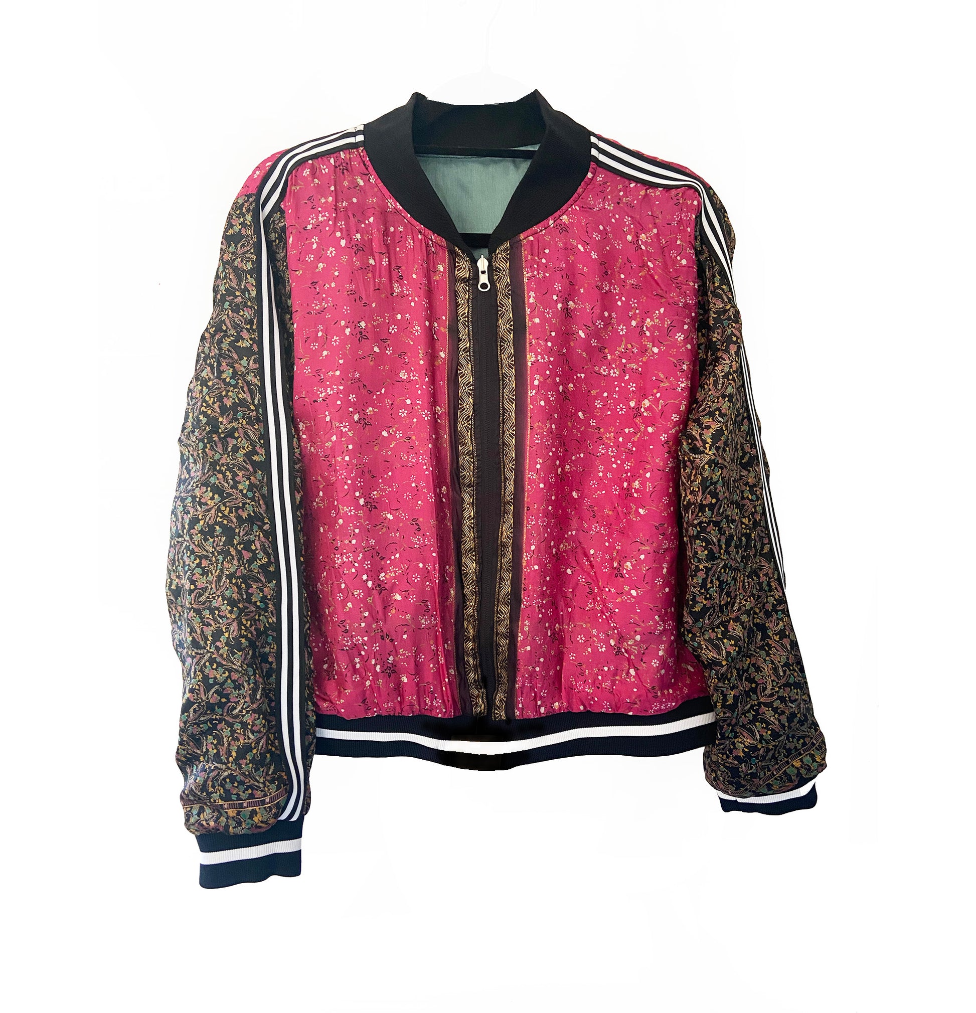 Pink and black floral jacket with patterned sleeves on a white background