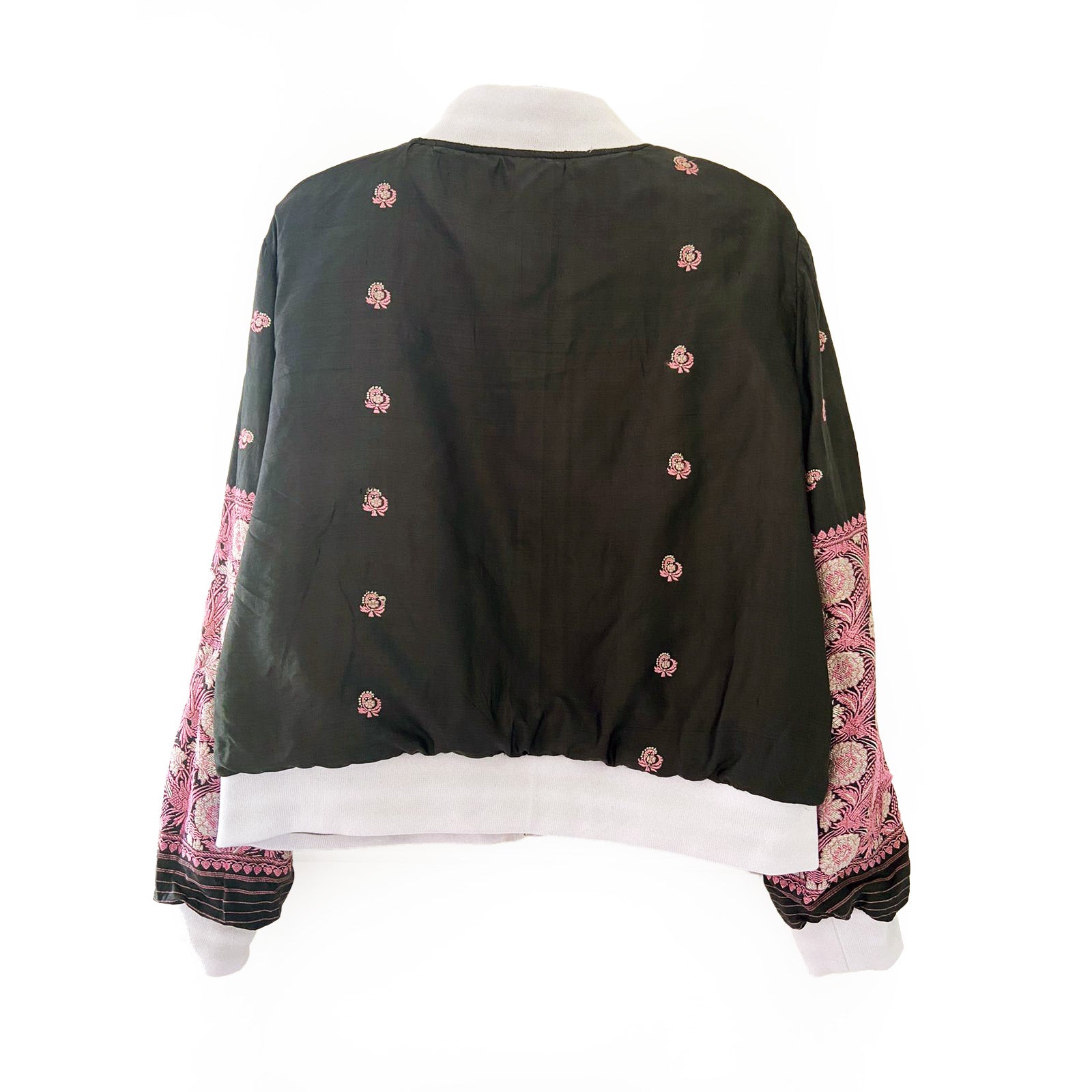 Black blouse with pink floral embroidery patterns on a white background