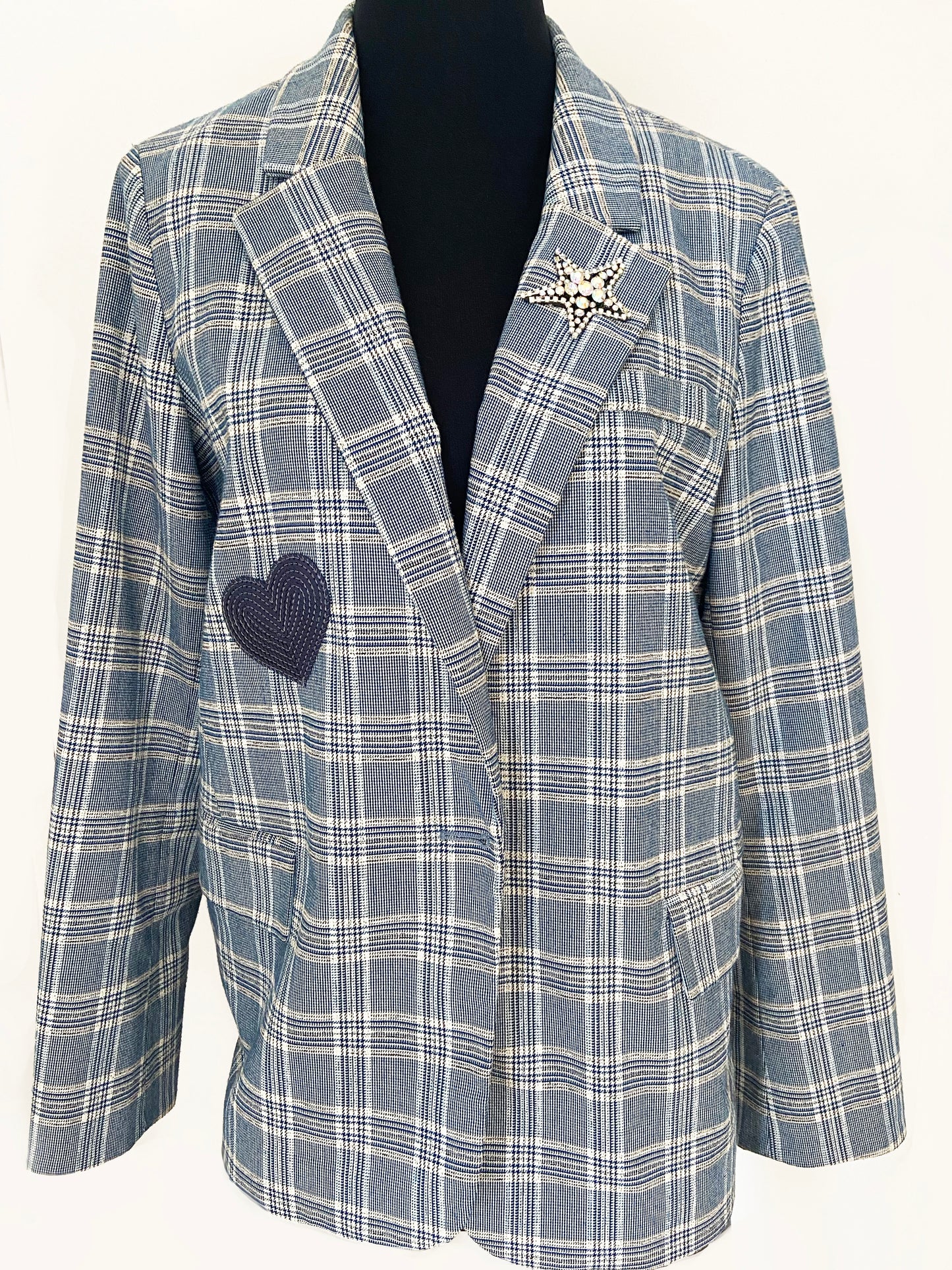 Blue and white checkered blazer with a heart-shaped patch on a white background