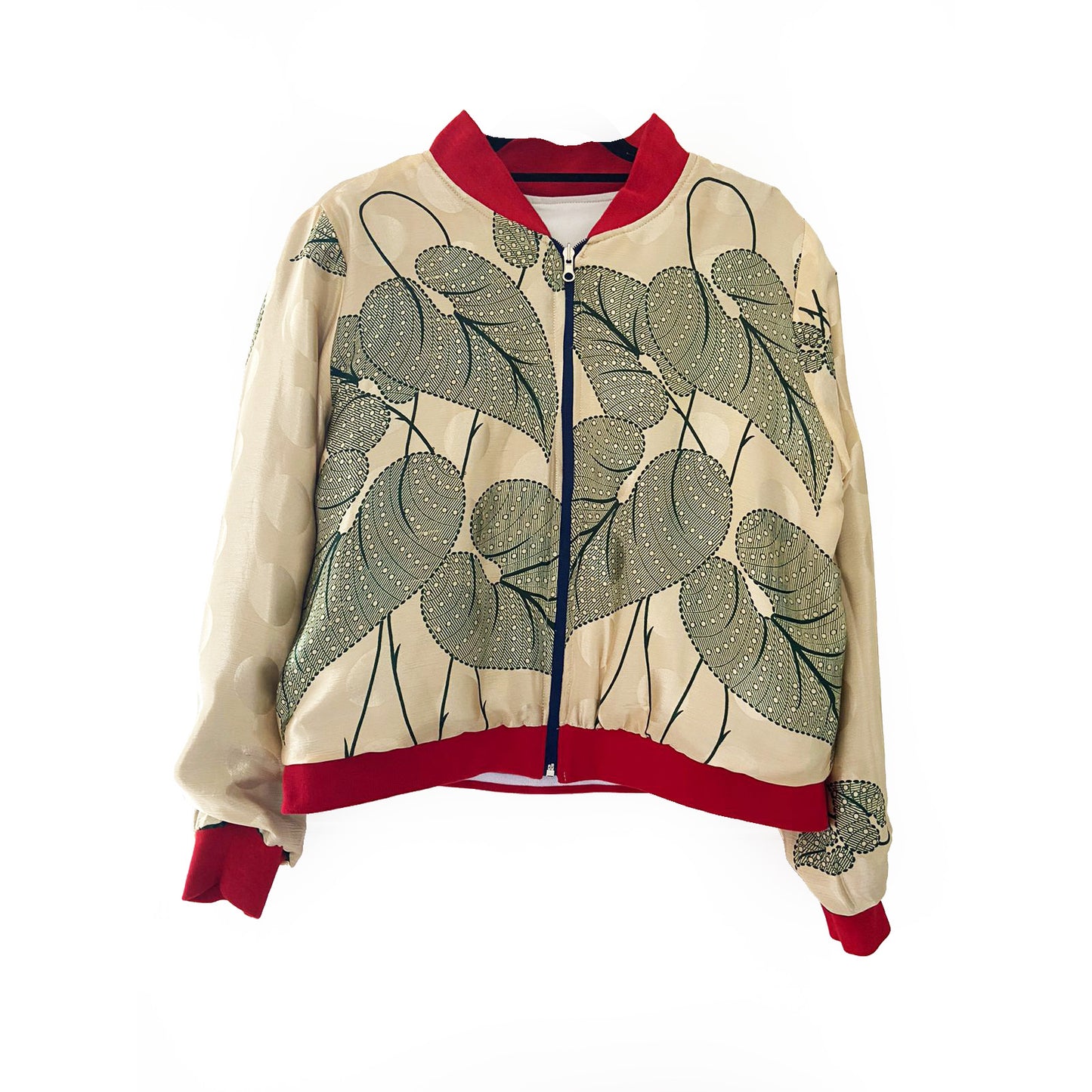 Cream bomber jacket with green leaf pattern and red accents on a white background