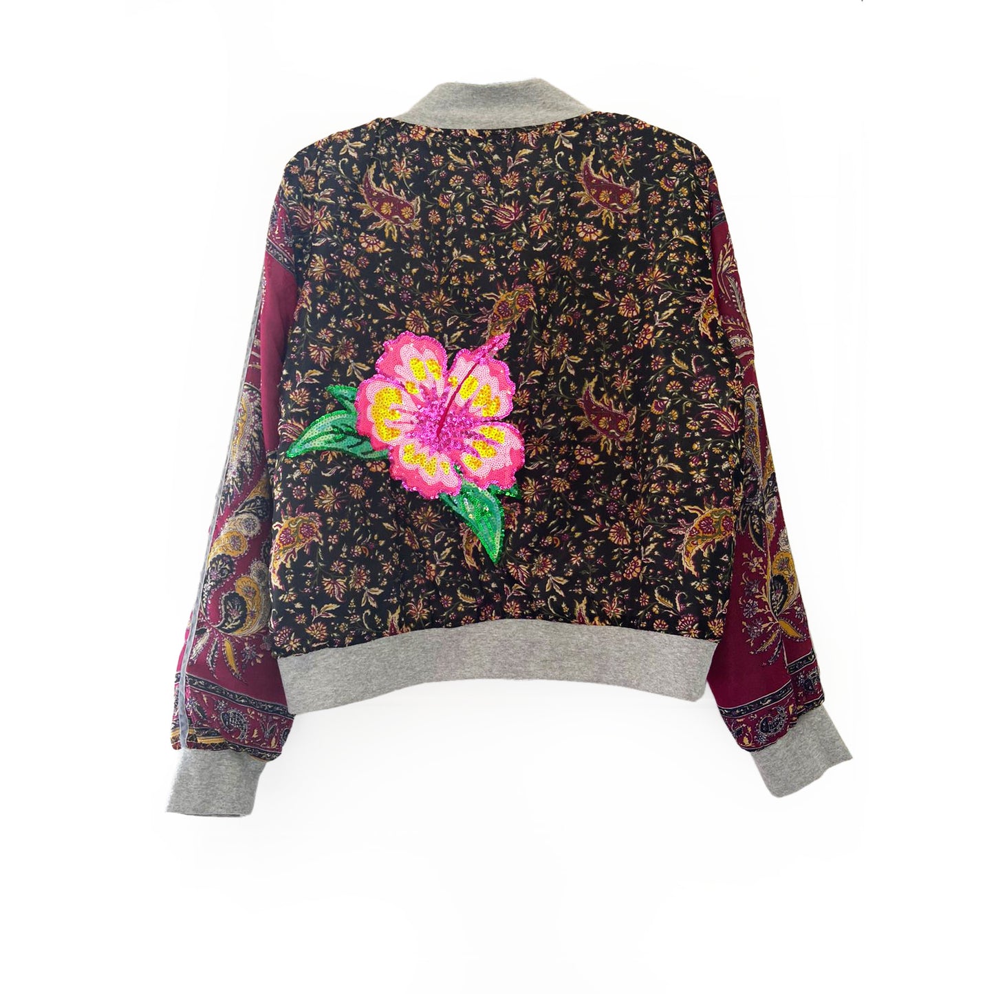 Floral patterned jacket with a pink flower design on a white background