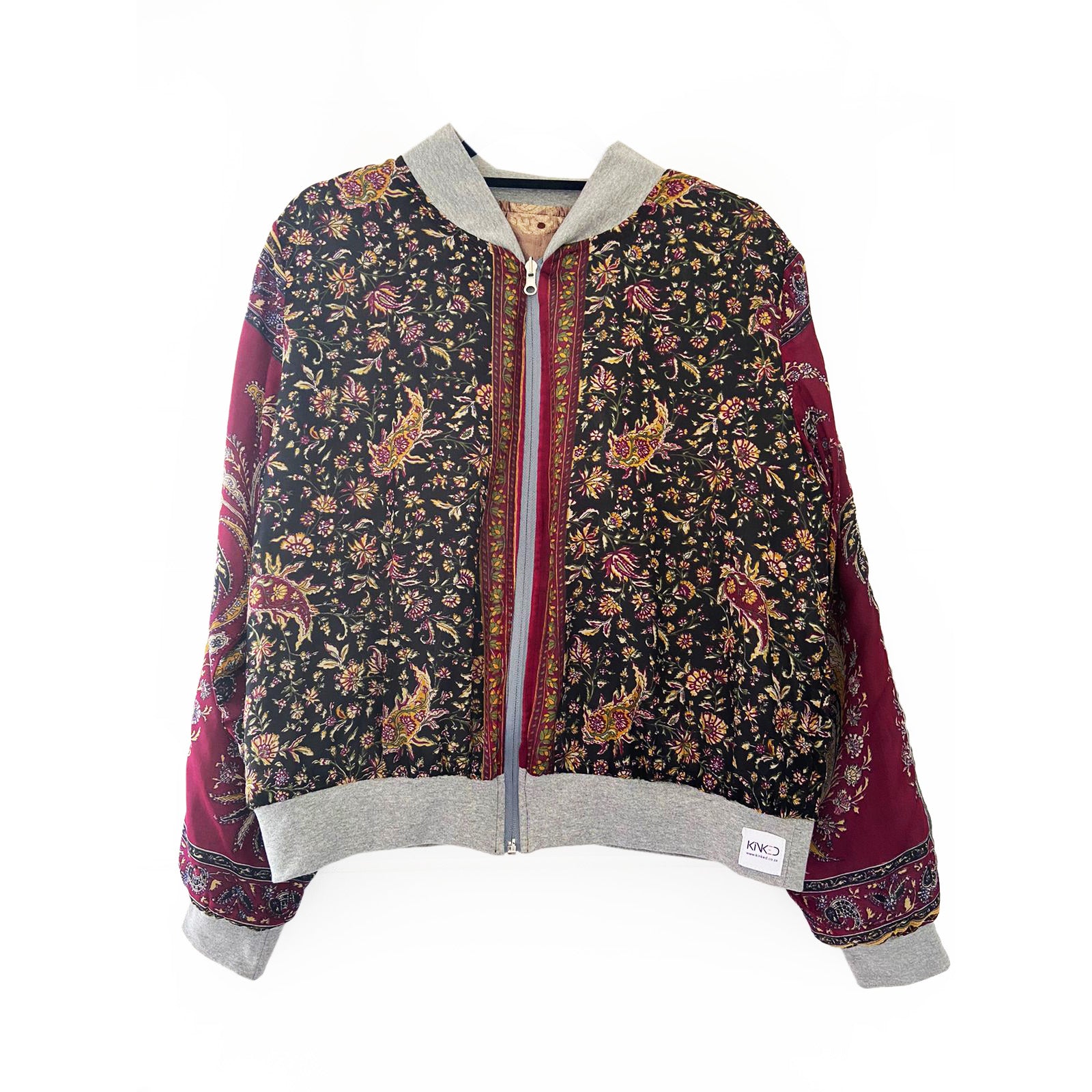 Floral patterned jacket with gray hood and trim on a white background