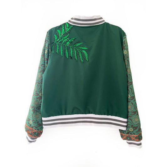 Green bomber jacket with floral patterns on sleeves and back, white collar with grey stripes on a white background