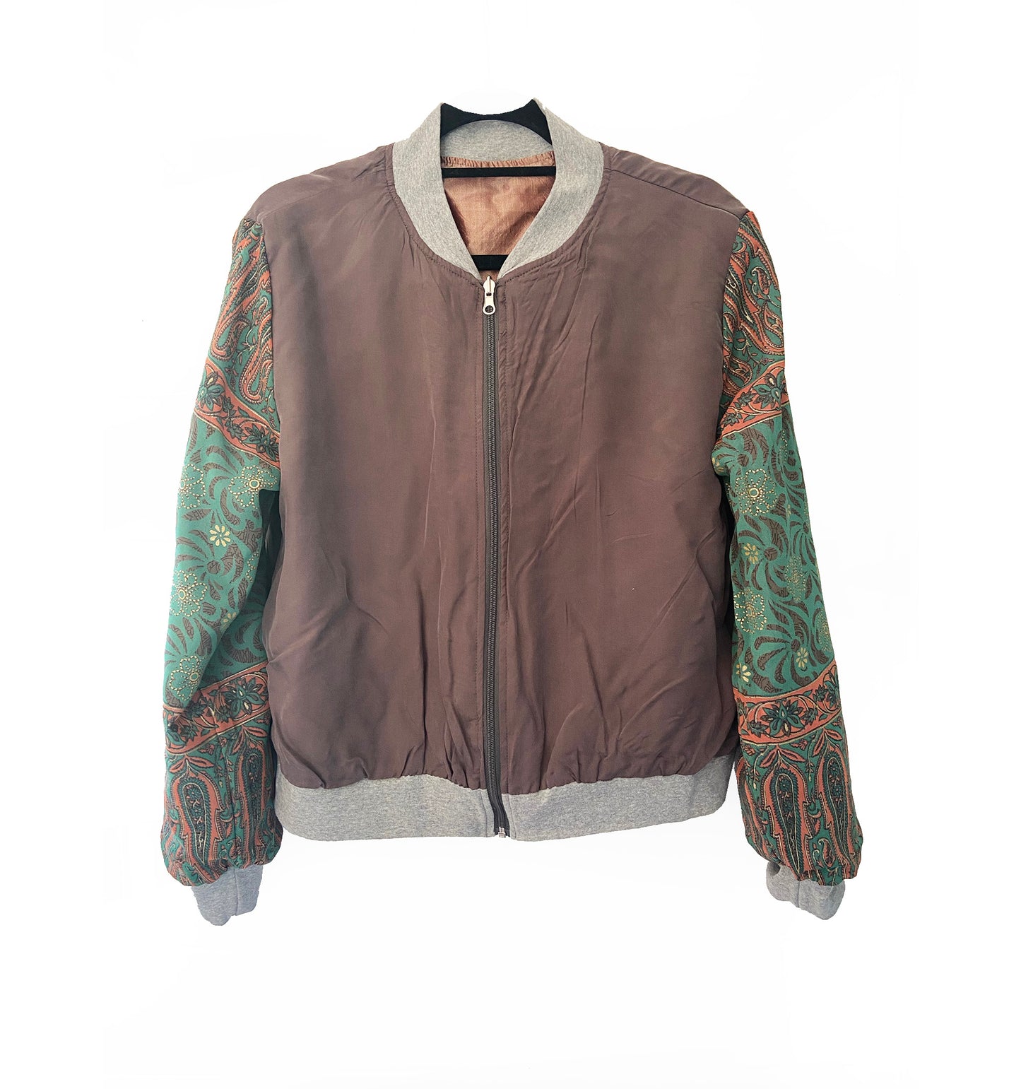 Grey jacket with patterned sleeves on a white background