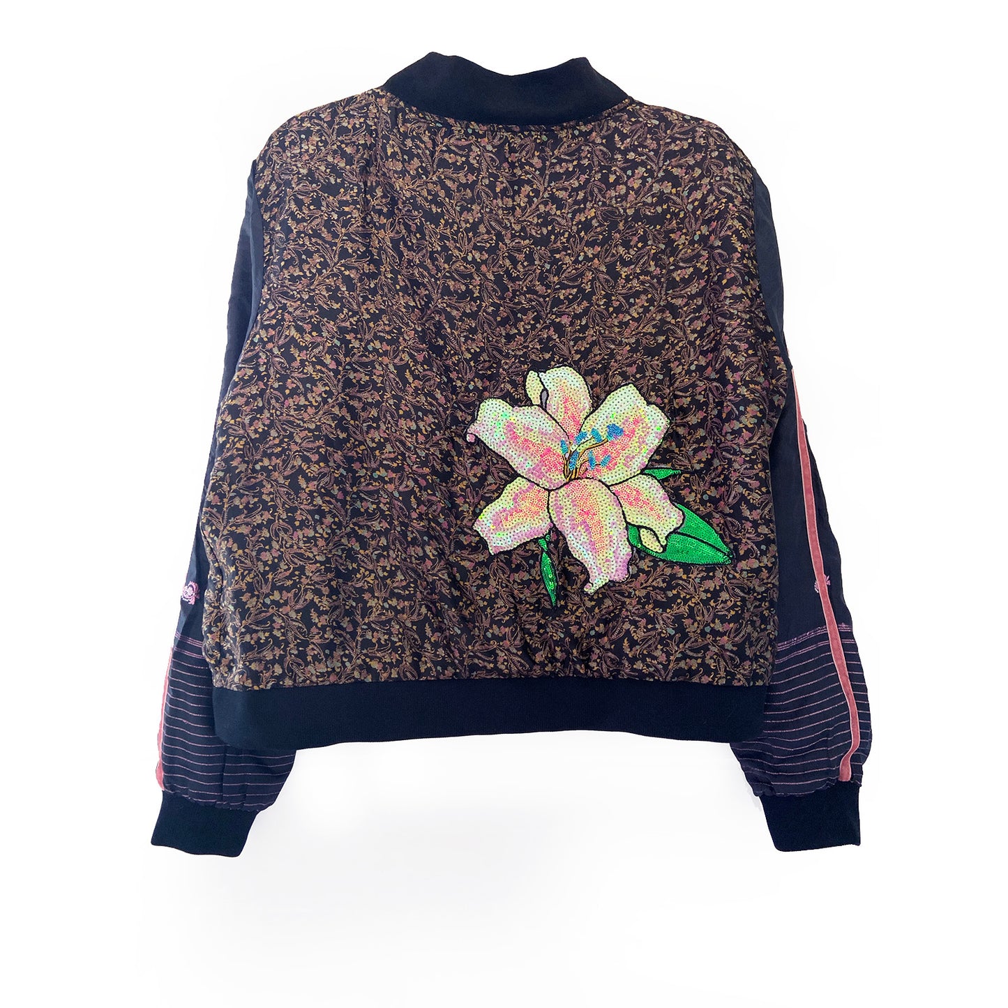 Back view of a black bomber jacket with floral sequin patch on a white background