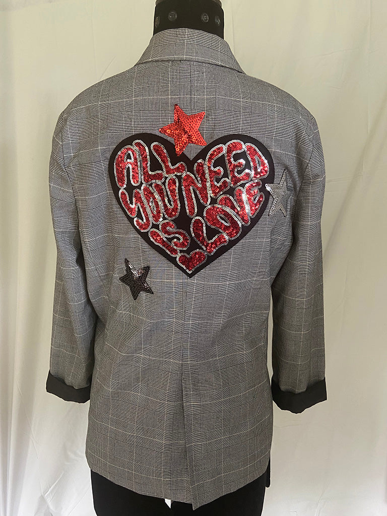 Gray checkered jacket with a heart-shaped patch and stars on a white background