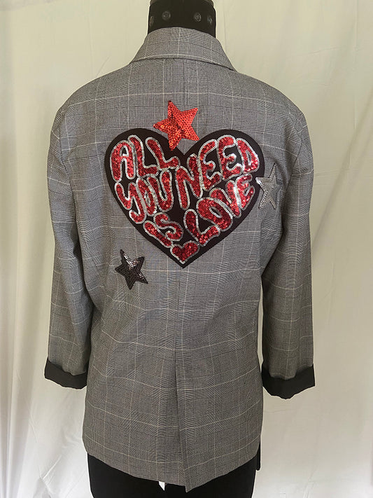 Gray checkered jacket with a heart-shaped patch and stars on a white background