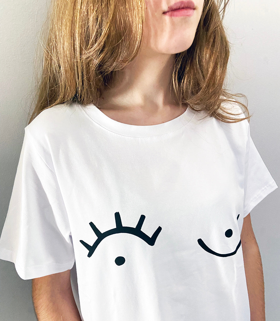 close up of white t-shirt with black graphic print