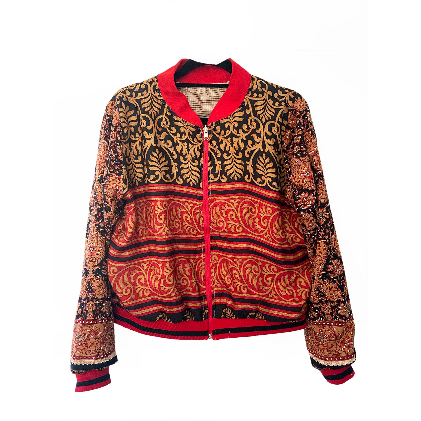 Patterned jacket with red accents on a white background