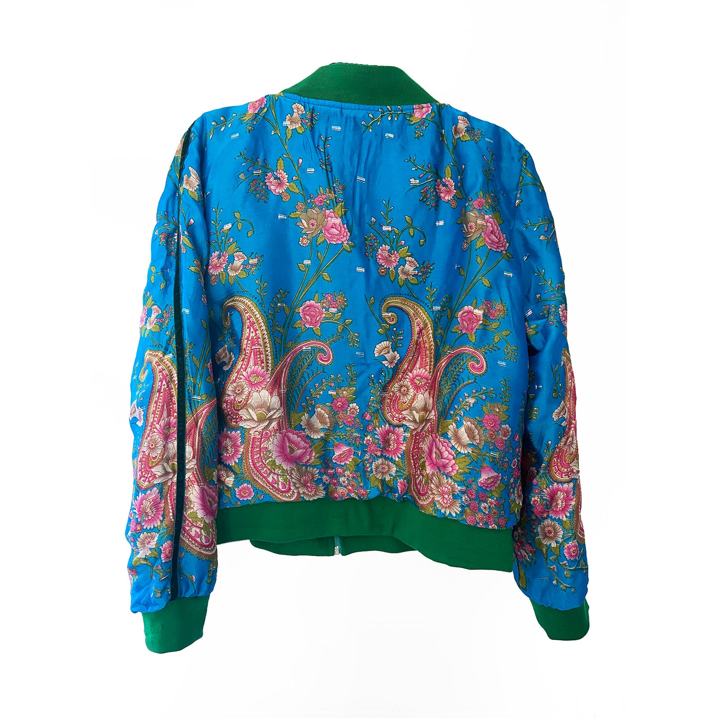 Back of turquoise floral and paisley patterned jacket on a white background