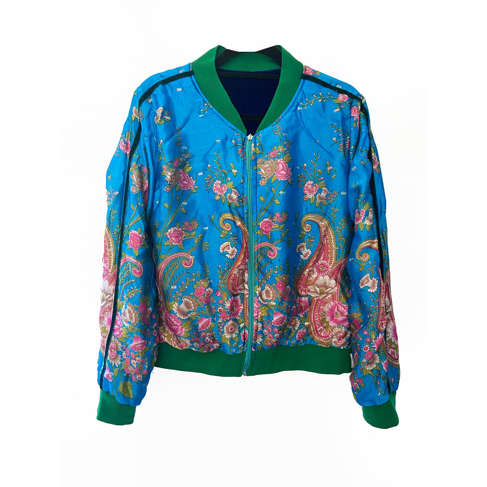 Turquoise floral and paisley patterned jacket on a white background