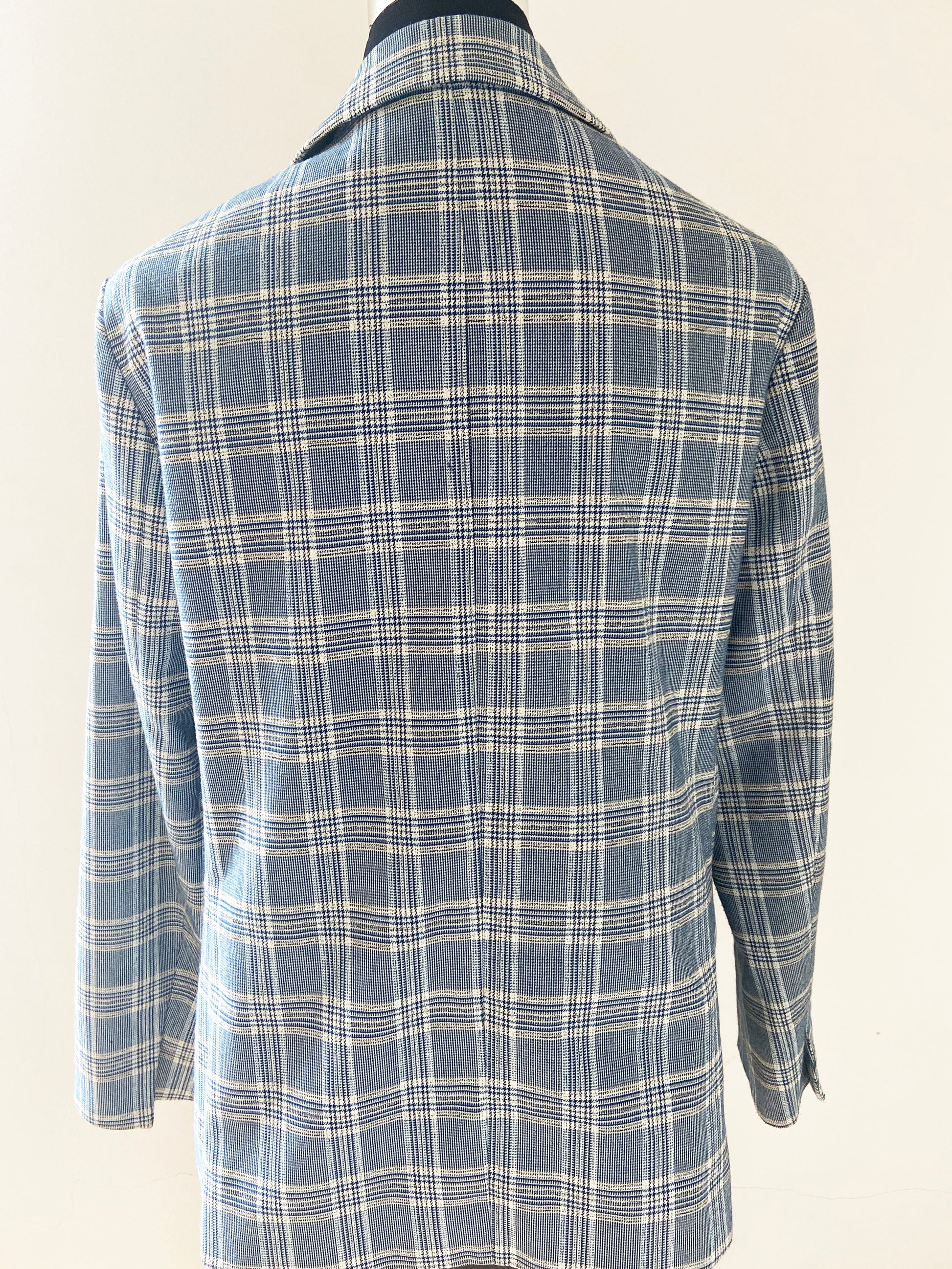 Blue and white plaid jacket on a mannequin against a white background